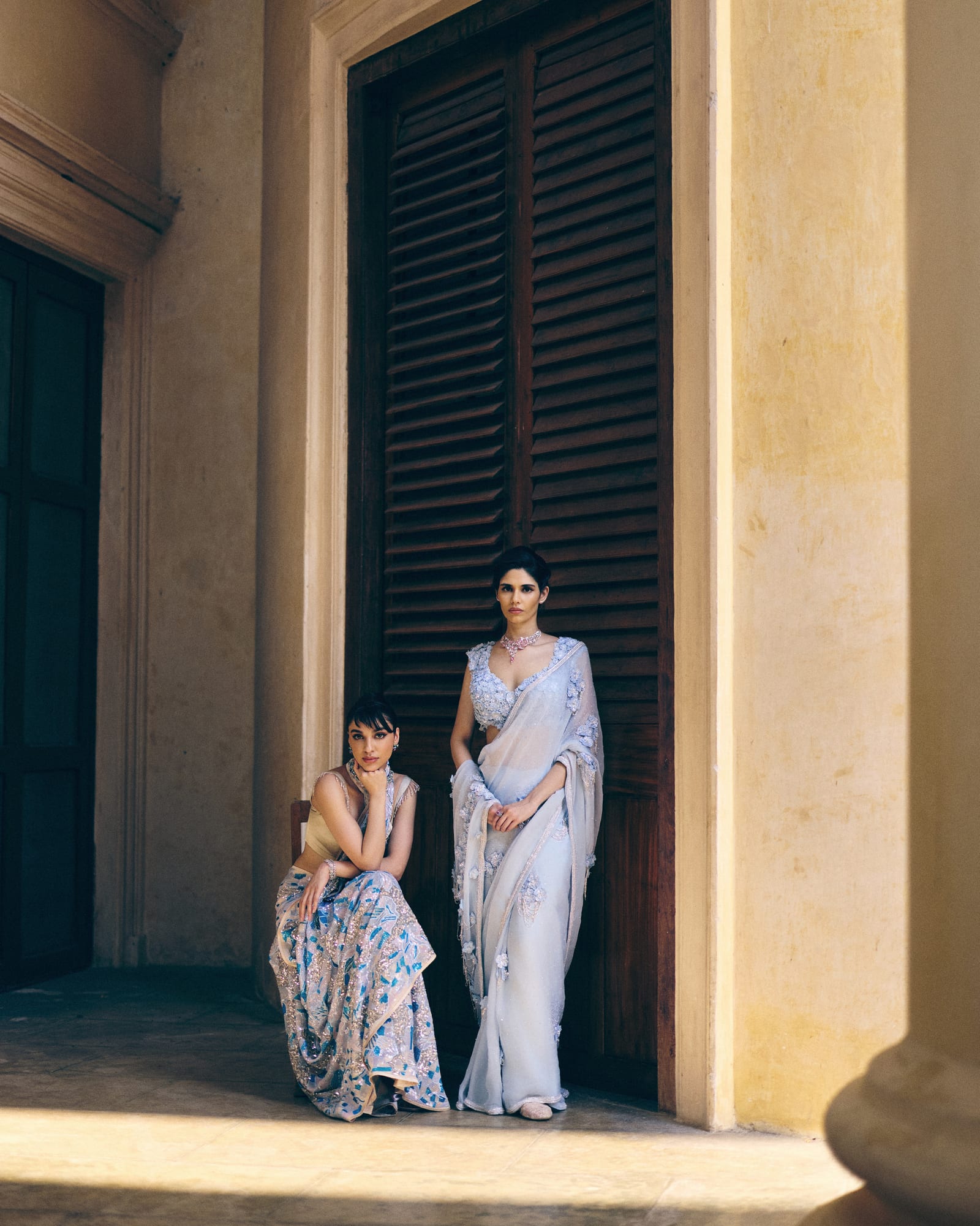 Aurelle blue couture portrait at the doorway